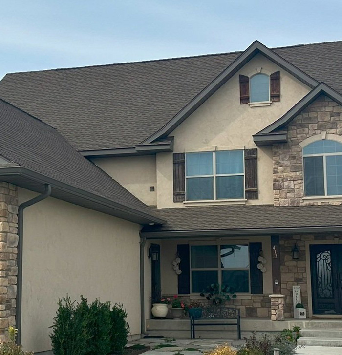 The same home showing the new roof AFTER it was repaired by Roof It Pros in Austin, Texas.