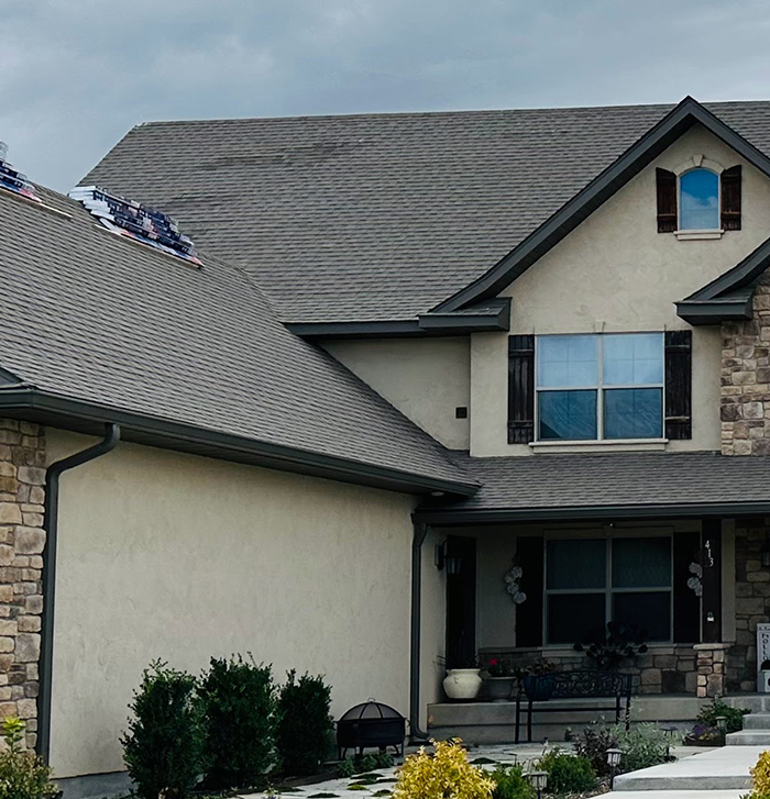 A home showing roof damage BEFORE it was repaired by Roof It Pros in Austin, Texas.