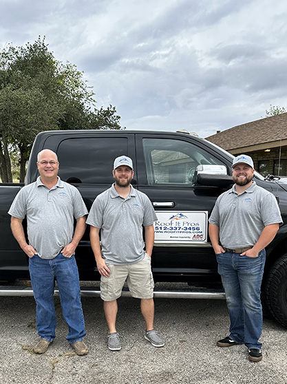 Eric, Brandon and Dillon standing in front of their service truck.